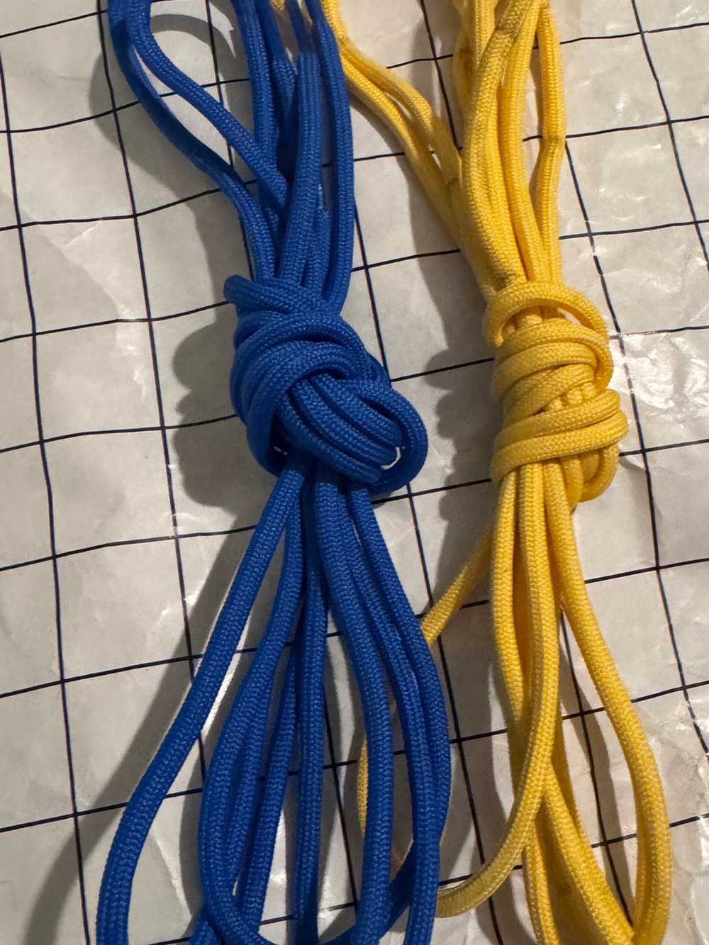One official Dr Martens yellow laces. Pics showing blue is for reference